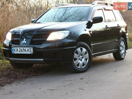 Чорний Міцубісі Аутлендер, об'ємом двигуна 2 л та пробігом 190 тис. км за 6900 $, фото 1 на Automoto.ua