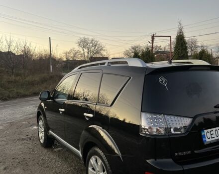 Черный Мицубиси Аутлендер, объемом двигателя 2.2 л и пробегом 238 тыс. км за 9700 $, фото 1 на Automoto.ua