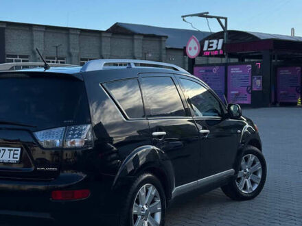 Черный Мицубиси Аутлендер, объемом двигателя 1.97 л и пробегом 202 тыс. км за 9700 $, фото 1 на Automoto.ua