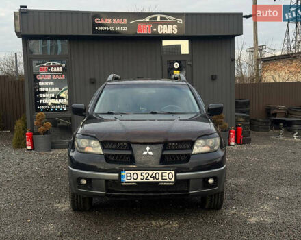 Черный Мицубиси Аутлендер, объемом двигателя 2 л и пробегом 240 тыс. км за 5500 $, фото 1 на Automoto.ua