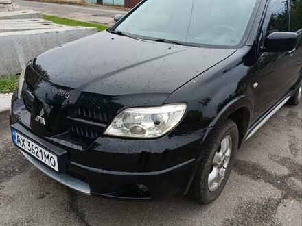 Черный Мицубиси Аутлендер, объемом двигателя 2 л и пробегом 270 тыс. км за 7200 $, фото 1 на Automoto.ua