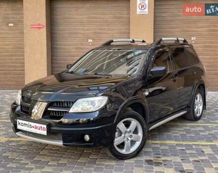 Черный Мицубиси Аутлендер, объемом двигателя 2 л и пробегом 270 тыс. км за 7199 $, фото 1 на Automoto.ua