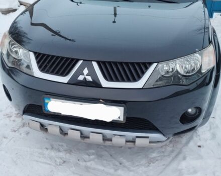 Черный Мицубиси Аутлендер, объемом двигателя 2.4 л и пробегом 227 тыс. км за 8800 $, фото 1 на Automoto.ua