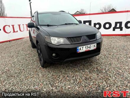 Черный Мицубиси Аутлендер, объемом двигателя 2.4 л и пробегом 200 тыс. км за 9999 $, фото 1 на Automoto.ua