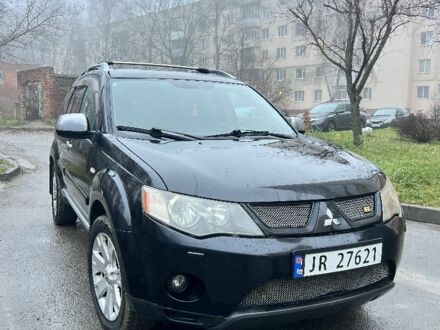Черный Мицубиси Аутлендер, объемом двигателя 2 л и пробегом 330 тыс. км за 4900 $, фото 1 на Automoto.ua
