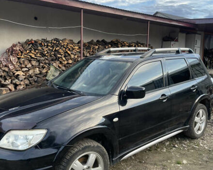 Черный Мицубиси Аутлендер, объемом двигателя 2 л и пробегом 156 тыс. км за 4000 $, фото 1 на Automoto.ua