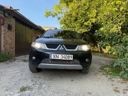 Черный Мицубиси Аутлендер, объемом двигателя 2 л и пробегом 451 тыс. км за 4000 $, фото 1 на Automoto.ua