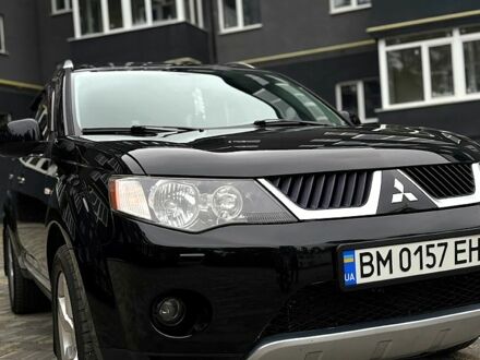 Черный Мицубиси Аутлендер, объемом двигателя 2.4 л и пробегом 210 тыс. км за 9900 $, фото 1 на Automoto.ua