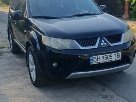 Черный Мицубиси Аутлендер, объемом двигателя 2.4 л и пробегом 325 тыс. км за 7500 $, фото 1 на Automoto.ua