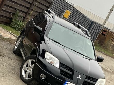 Черный Мицубиси Аутлендер, объемом двигателя 2.4 л и пробегом 178 тыс. км за 6900 $, фото 1 на Automoto.ua