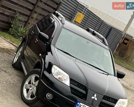 Черный Мицубиси Аутлендер, объемом двигателя 2.4 л и пробегом 178 тыс. км за 6900 $, фото 1 на Automoto.ua