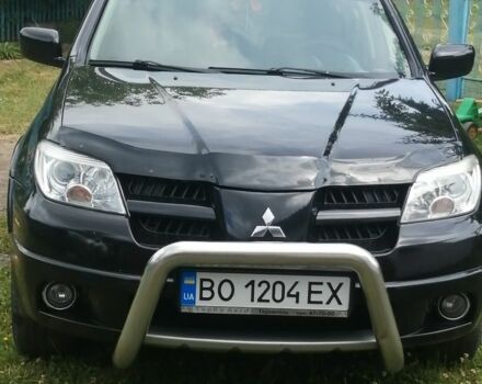 Черный Мицубиси Аутлендер, объемом двигателя 2 л и пробегом 208 тыс. км за 6700 $, фото 1 на Automoto.ua