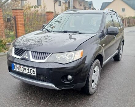 Черный Мицубиси Аутлендер, объемом двигателя 2 л и пробегом 226 тыс. км за 4700 $, фото 1 на Automoto.ua