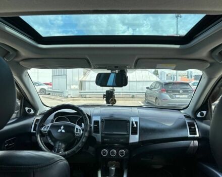 Черный Мицубиси Аутлендер, объемом двигателя 2.4 л и пробегом 137 тыс. км за 8999 $, фото 1 на Automoto.ua