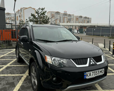 Черный Мицубиси Аутлендер, объемом двигателя 2.36 л и пробегом 120 тыс. км за 10100 $, фото 1 на Automoto.ua