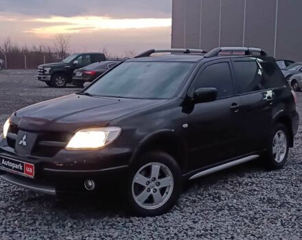 Черный Мицубиси Аутлендер, объемом двигателя 2 л и пробегом 271 тыс. км за 6940 $, фото 1 на Automoto.ua
