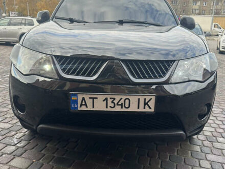 Черный Мицубиси Аутлендер, объемом двигателя 2.4 л и пробегом 199 тыс. км за 8777 $, фото 1 на Automoto.ua