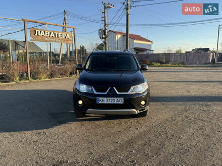 Черный Мицубиси Аутлендер, объемом двигателя 3 л и пробегом 150 тыс. км за 9499 $, фото 1 на Automoto.ua