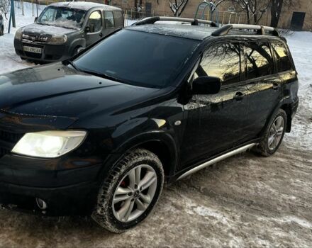 Чорний Міцубісі Аутлендер, об'ємом двигуна 2.4 л та пробігом 350 тис. км за 6900 $, фото 1 на Automoto.ua