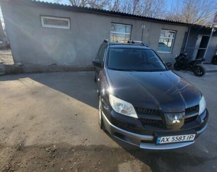 Черный Мицубиси Аутлендер, объемом двигателя 2 л и пробегом 189 тыс. км за 7800 $, фото 1 на Automoto.ua