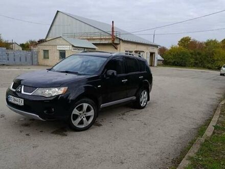 Черный Мицубиси Аутлендер, объемом двигателя 2.2 л и пробегом 200 тыс. км за 9500 $, фото 1 на Automoto.ua