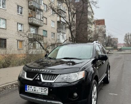 Черный Мицубиси Аутлендер, объемом двигателя 2 л и пробегом 377 тыс. км за 5200 $, фото 1 на Automoto.ua