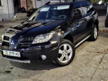 Черный Мицубиси Аутлендер, объемом двигателя 2 л и пробегом 117 тыс. км за 7900 $, фото 1 на Automoto.ua