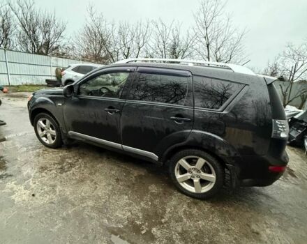 Черный Мицубиси Аутлендер, объемом двигателя 2.4 л и пробегом 215 тыс. км за 8300 $, фото 1 на Automoto.ua