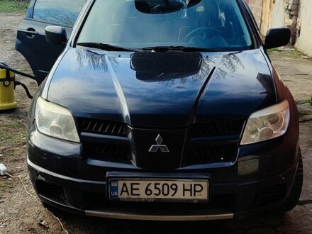 Чорний Міцубісі Аутлендер, об'ємом двигуна 2 л та пробігом 212 тис. км за 6900 $, фото 1 на Automoto.ua