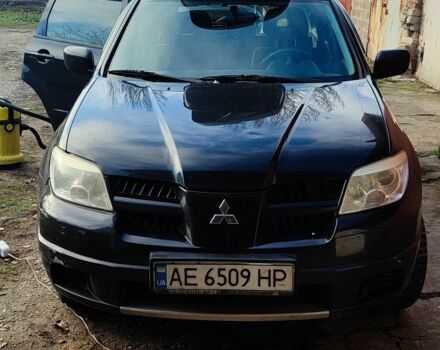 Черный Мицубиси Аутлендер, объемом двигателя 2 л и пробегом 212 тыс. км за 6900 $, фото 1 на Automoto.ua