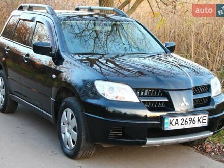 Чорний Міцубісі Аутлендер, об'ємом двигуна 2 л та пробігом 189 тис. км за 7200 $, фото 1 на Automoto.ua