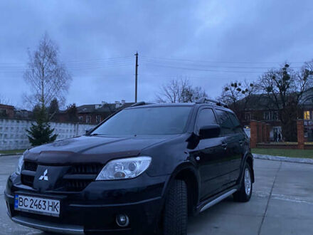 Черный Мицубиси Аутлендер, объемом двигателя 2 л и пробегом 271 тыс. км за 6799 $, фото 1 на Automoto.ua
