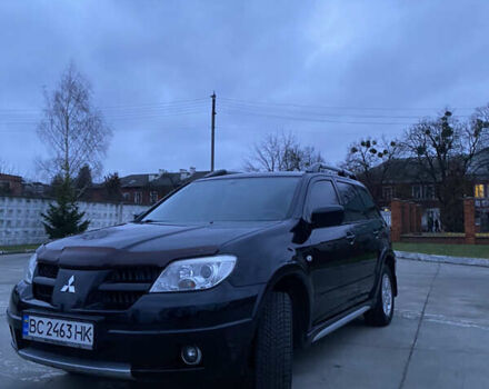 Чорний Міцубісі Аутлендер, об'ємом двигуна 2 л та пробігом 271 тис. км за 6799 $, фото 1 на Automoto.ua