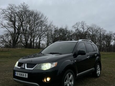 Черный Мицубиси Аутлендер, объемом двигателя 2.4 л и пробегом 230 тыс. км за 8800 $, фото 1 на Automoto.ua