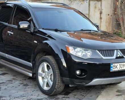 Чорний Міцубісі Аутлендер, об'ємом двигуна 2.4 л та пробігом 230 тис. км за 9700 $, фото 1 на Automoto.ua