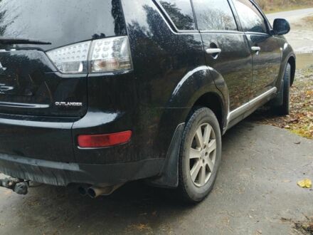 Черный Мицубиси Аутлендер, объемом двигателя 2 л и пробегом 242 тыс. км за 5500 $, фото 1 на Automoto.ua