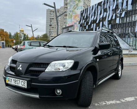 Чорний Міцубісі Аутлендер, об'ємом двигуна 2 л та пробігом 163 тис. км за 7200 $, фото 1 на Automoto.ua