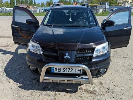 Черный Мицубиси Аутлендер, объемом двигателя 2 л и пробегом 189 тыс. км за 7100 $, фото 1 на Automoto.ua