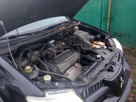 Чорний Міцубісі Аутлендер, об'ємом двигуна 2 л та пробігом 220 тис. км за 5599 $, фото 1 на Automoto.ua