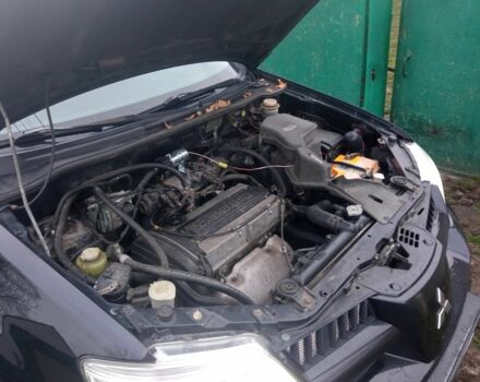 Чорний Міцубісі Аутлендер, об'ємом двигуна 2 л та пробігом 220 тис. км за 5599 $, фото 1 на Automoto.ua