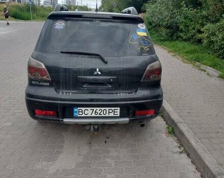 Чорний Міцубісі Аутлендер, об'ємом двигуна 2 л та пробігом 162 тис. км за 7100 $, фото 1 на Automoto.ua