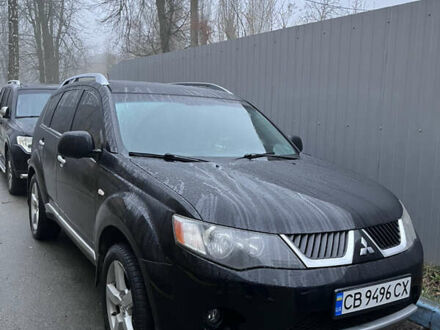 Черный Мицубиси Аутлендер, объемом двигателя 2.4 л и пробегом 237 тыс. км за 5000 $, фото 1 на Automoto.ua