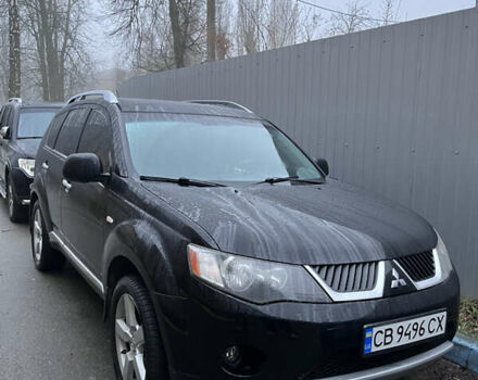Черный Мицубиси Аутлендер, объемом двигателя 2.4 л и пробегом 237 тыс. км за 5000 $, фото 1 на Automoto.ua