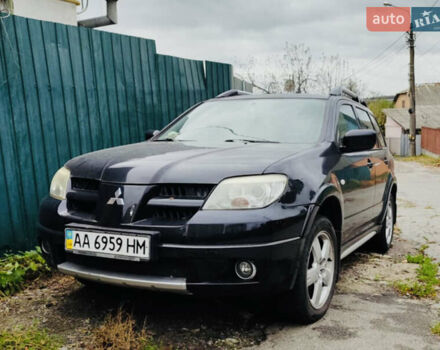 Чорний Міцубісі Аутлендер, об'ємом двигуна 2.4 л та пробігом 200 тис. км за 6790 $, фото 1 на Automoto.ua
