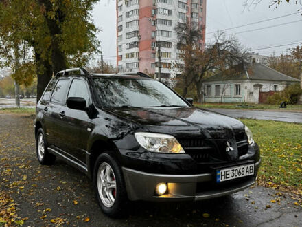 Чорний Міцубісі Аутлендер, об'ємом двигуна 2 л та пробігом 254 тис. км за 7300 $, фото 1 на Automoto.ua