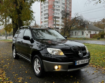 Чорний Міцубісі Аутлендер, об'ємом двигуна 2 л та пробігом 254 тис. км за 7300 $, фото 1 на Automoto.ua