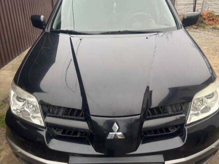 Чорний Міцубісі Аутлендер, об'ємом двигуна 2 л та пробігом 130 тис. км за 7500 $, фото 1 на Automoto.ua