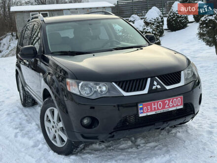 Черный Мицубиси Аутлендер, объемом двигателя 2 л и пробегом 219 тыс. км за 9300 $, фото 1 на Automoto.ua