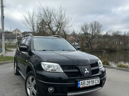 Черный Мицубиси Аутлендер, объемом двигателя 2 л и пробегом 118 тыс. км за 8100 $, фото 1 на Automoto.ua