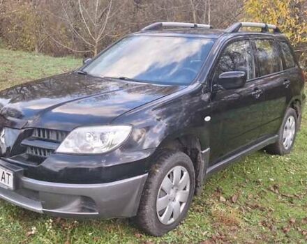 Чорний Міцубісі Аутлендер, об'ємом двигуна 2 л та пробігом 112 тис. км за 7350 $, фото 1 на Automoto.ua